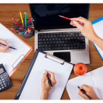 Group of people working with notepads and laptop