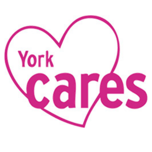 york cares logo. Pink text in a pink outline of a heart.